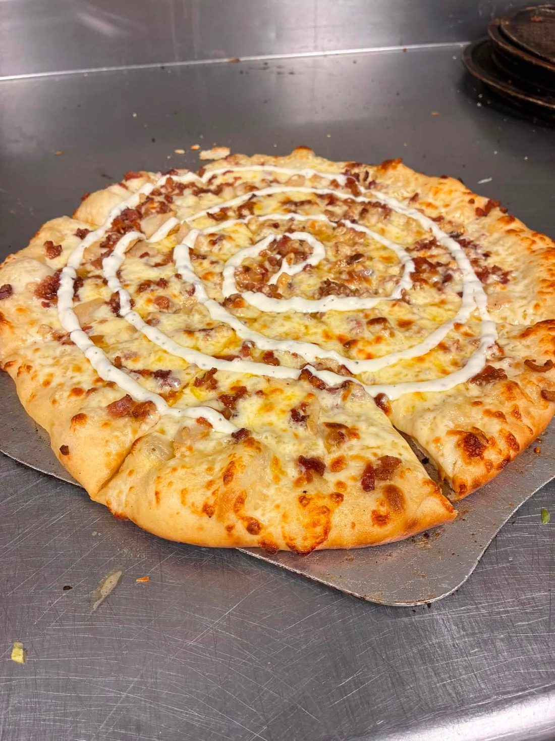 Pizza with a ranch swirl on top